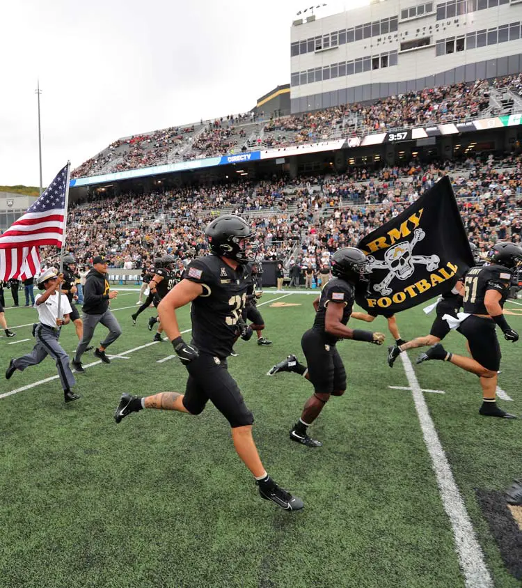 Football players running on the field